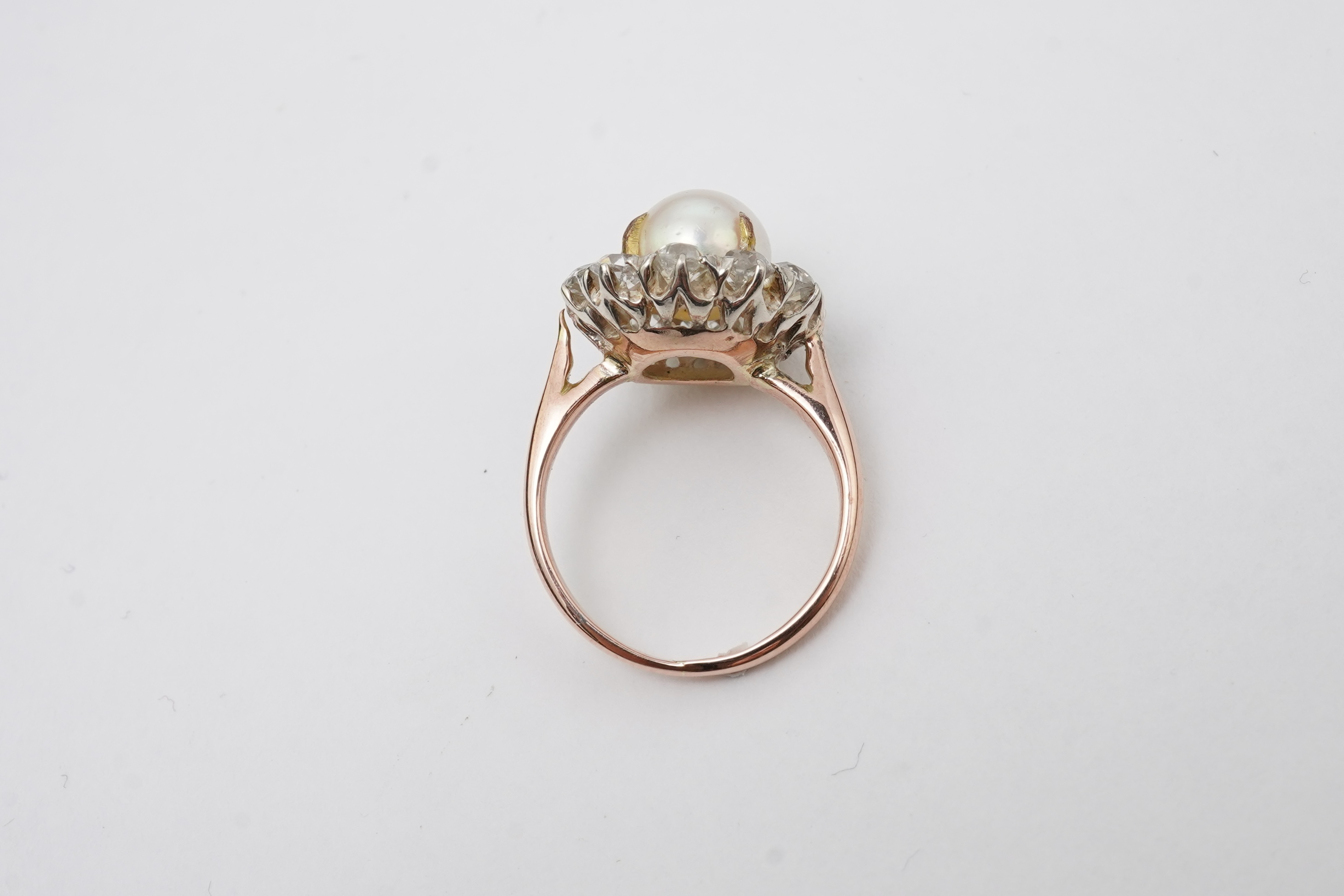A cultured pearl and diamond ring